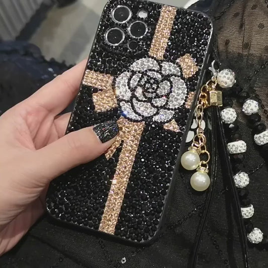 Funda hecha a mano para iPhone de lujo con pedrería brillante, lazo y flor en la parte trasera